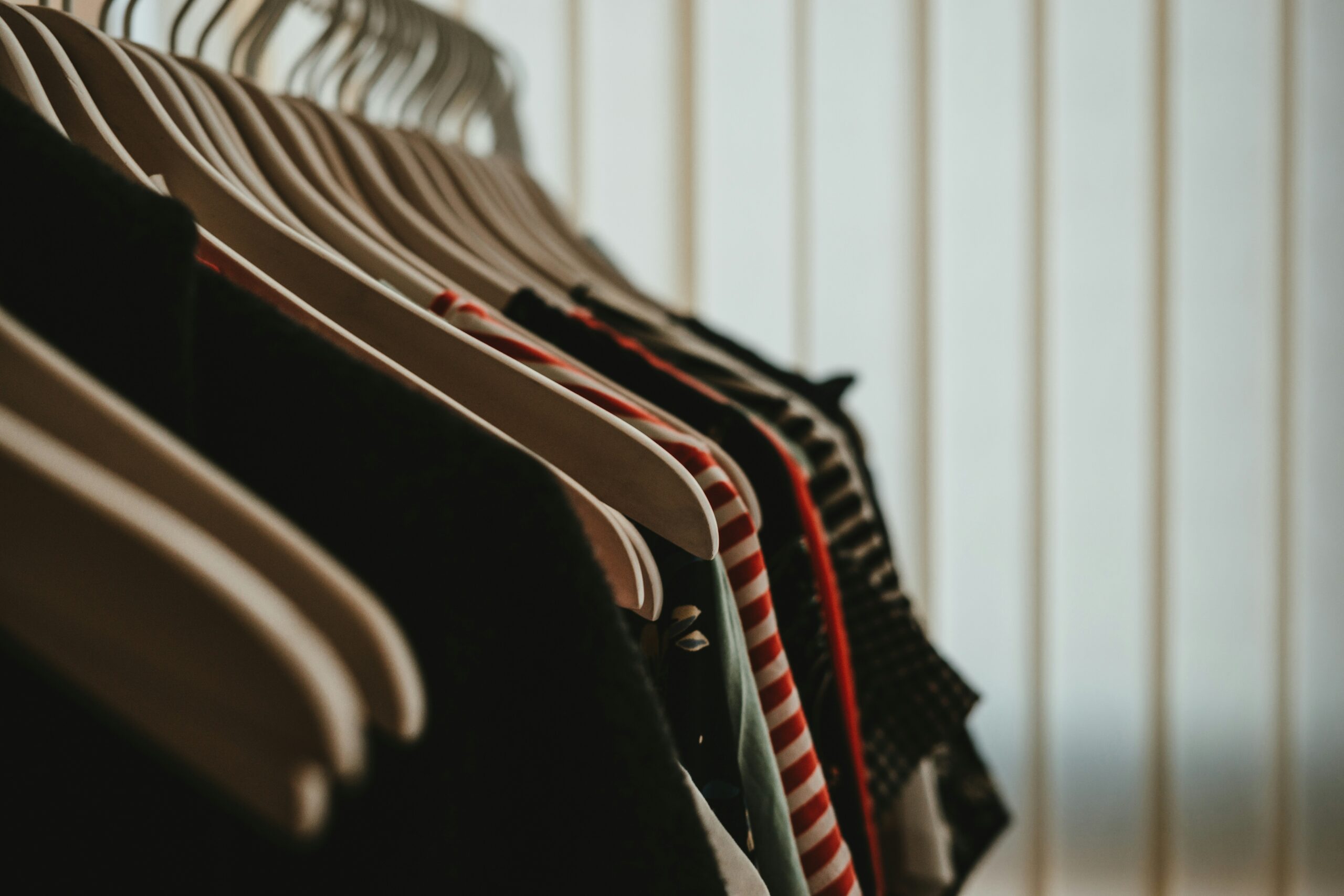 A shopper browsing racks of activewear inside Bloomingdale’s store.