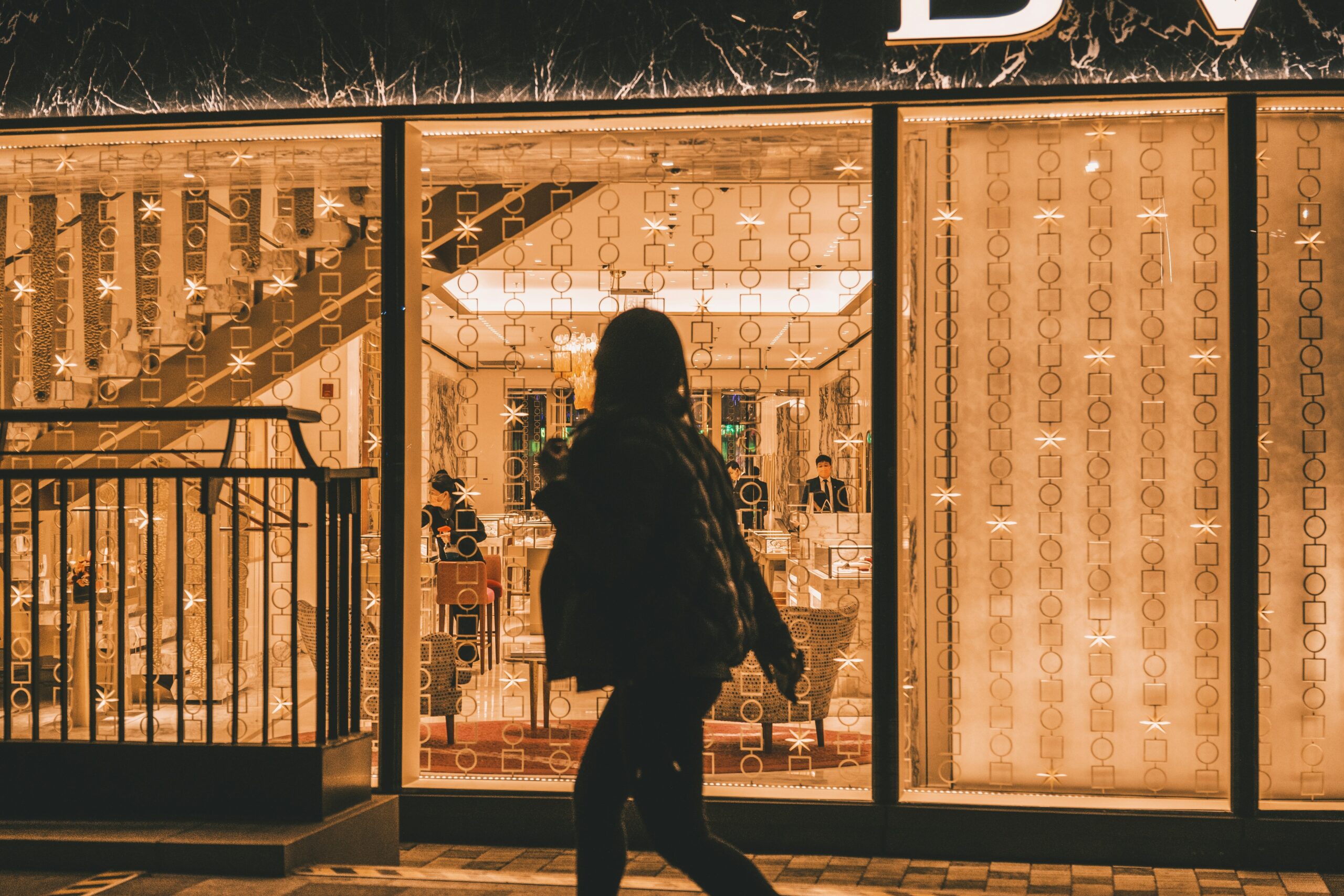 Bloomingdale’s storefront with shoppers walking inside