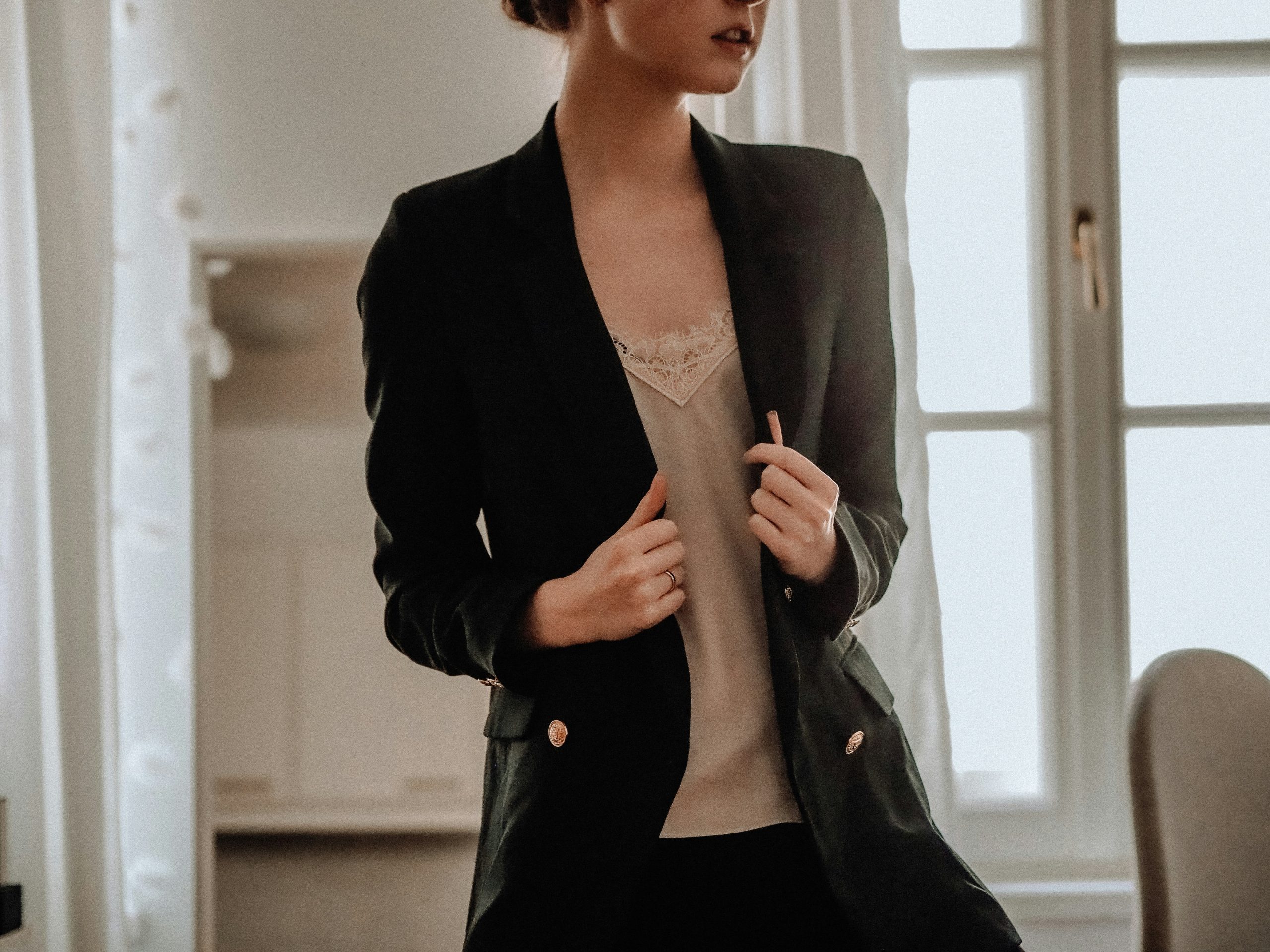 Emily in workplace-appropriate attire combining blazer elegance with comfy tee undershirt