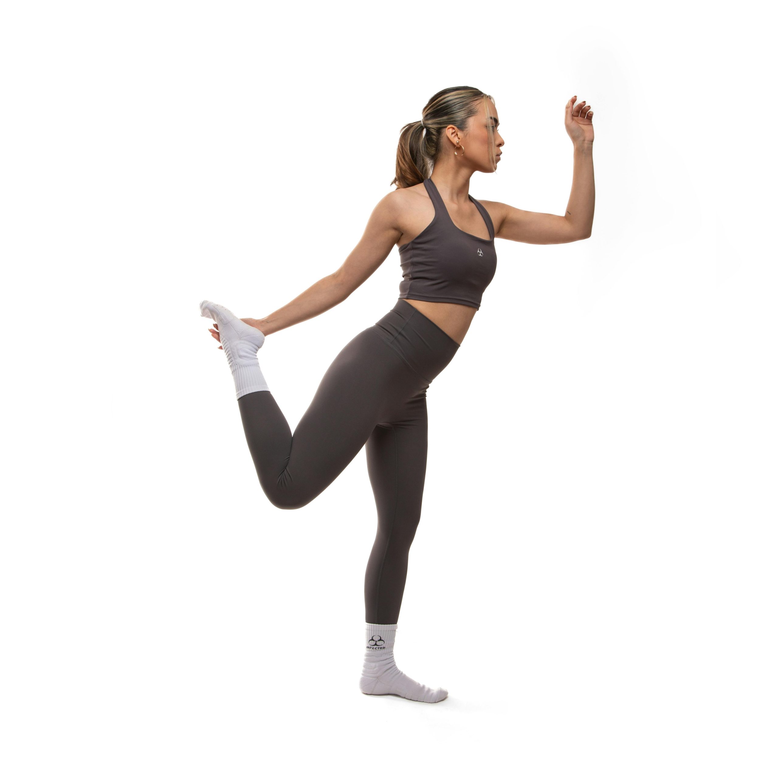 Model showcasing matching sports bra and leggings set at Bloomingdales