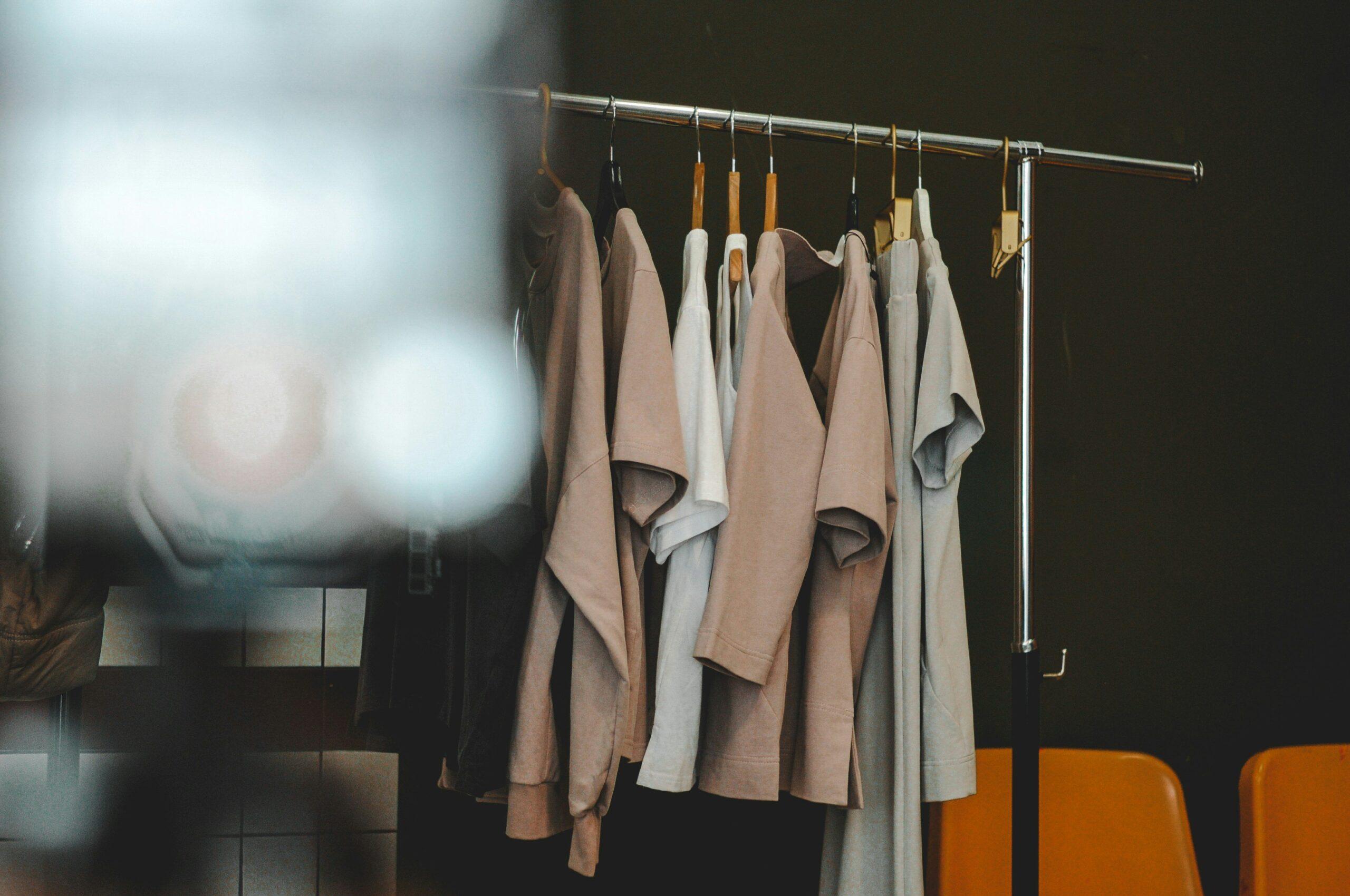 A messy closet filled with clothes spilling out