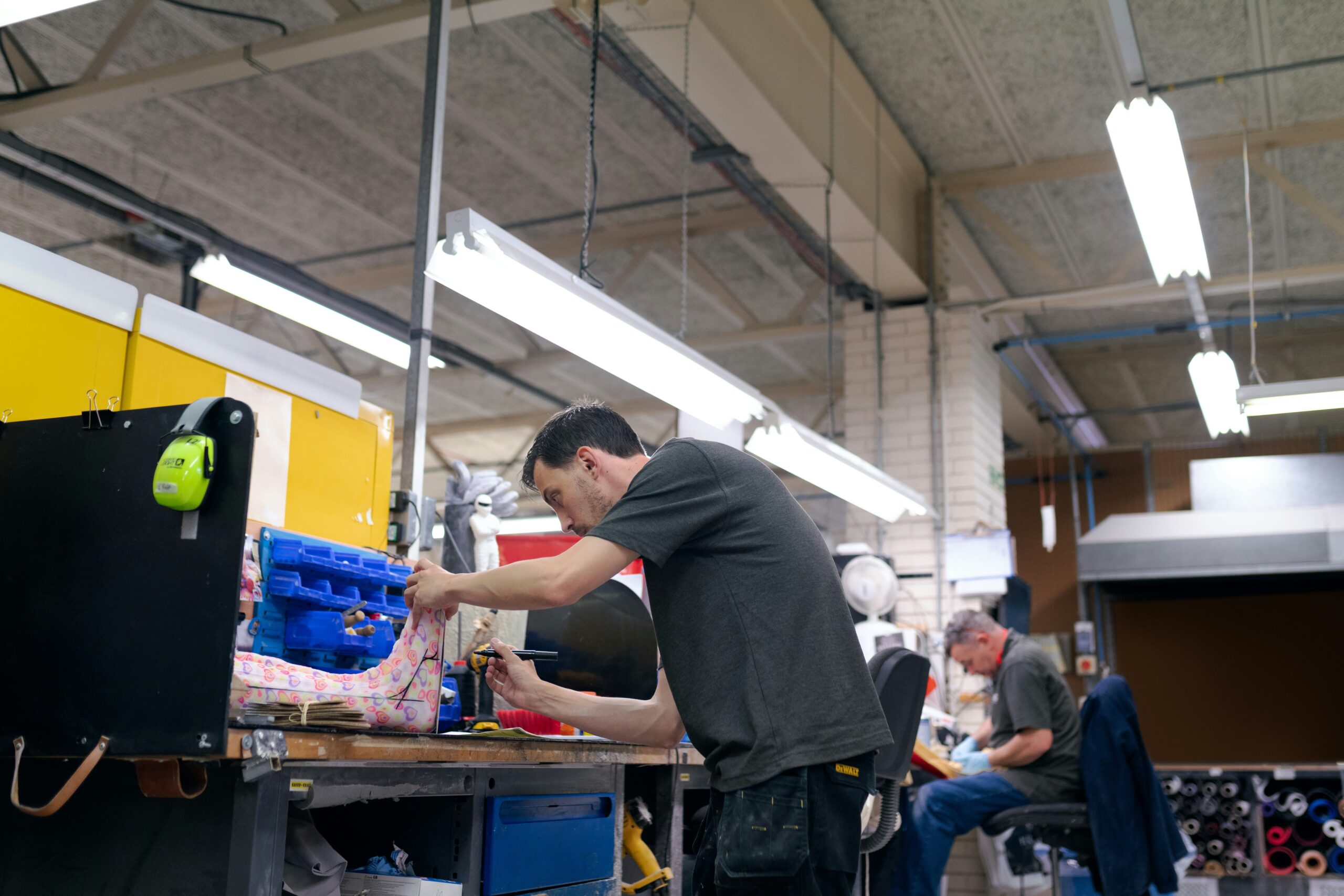 A scientist testing fabric durability in a lab