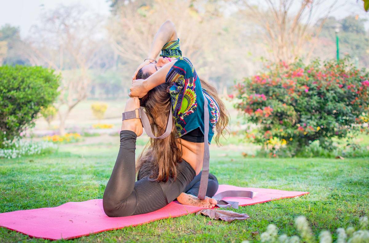 A customer browsing through racks of wellness wear at Bloomingdale's, highlighting key considerations like fabric type and fit.