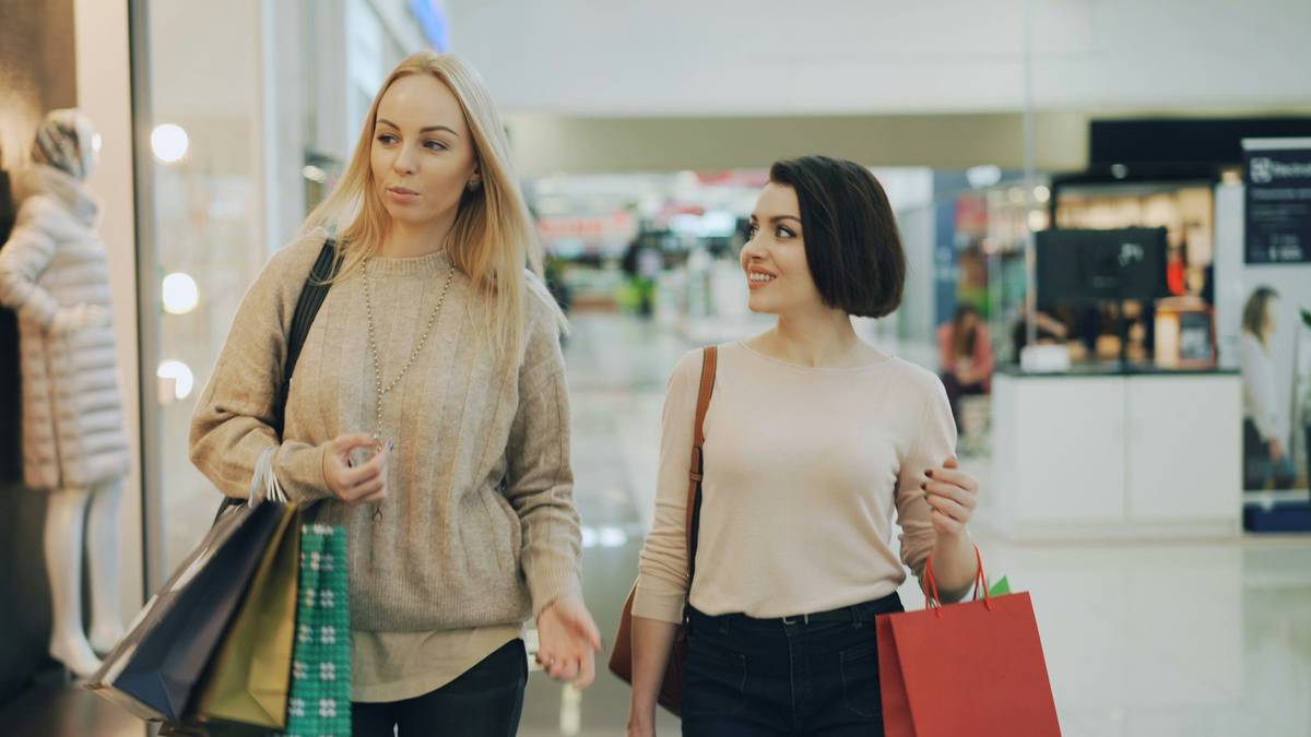 Two individuals smiling while holding their favorite Bloomingdale's wellness finds