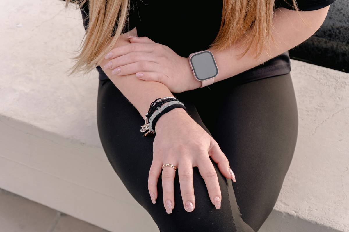 Side-by-side comparison of Bloomingdale's fitness leggings showing fabric thickness, seam construction, and opacity under bright light