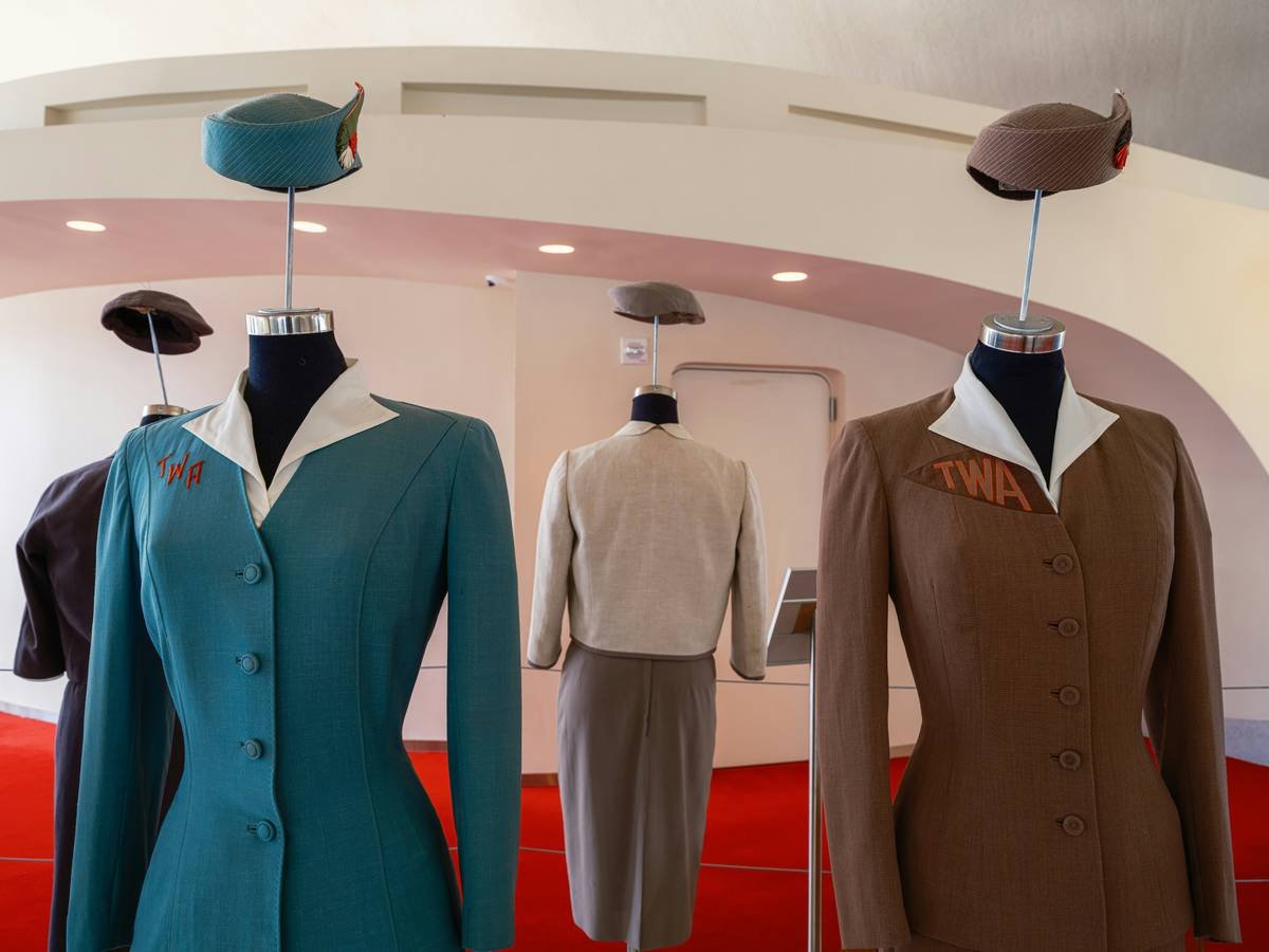 Timeline infographic showing key moments in power dressing history from 1978 to 2024, including Bloomingdale's 1982 campaign and modern wellness-focused suiting